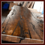 Rustic wooden table with dark grain patterns.